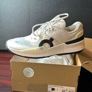 On Running Men's Cream and Black Sneakers THE ROGER PRO 2 clay